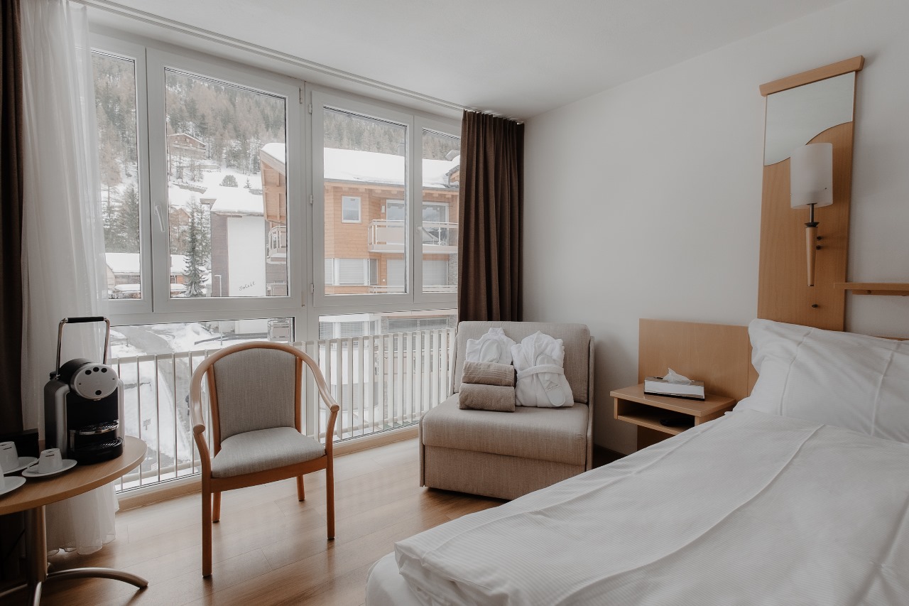 Cozy premium room with stunning Grächen mountain views at Hotel Grächerhof