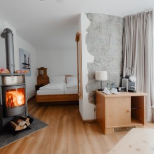 Elegant and spacious hotel room at Hotel Grächerhof, perfect for a Swiss Alps getaway