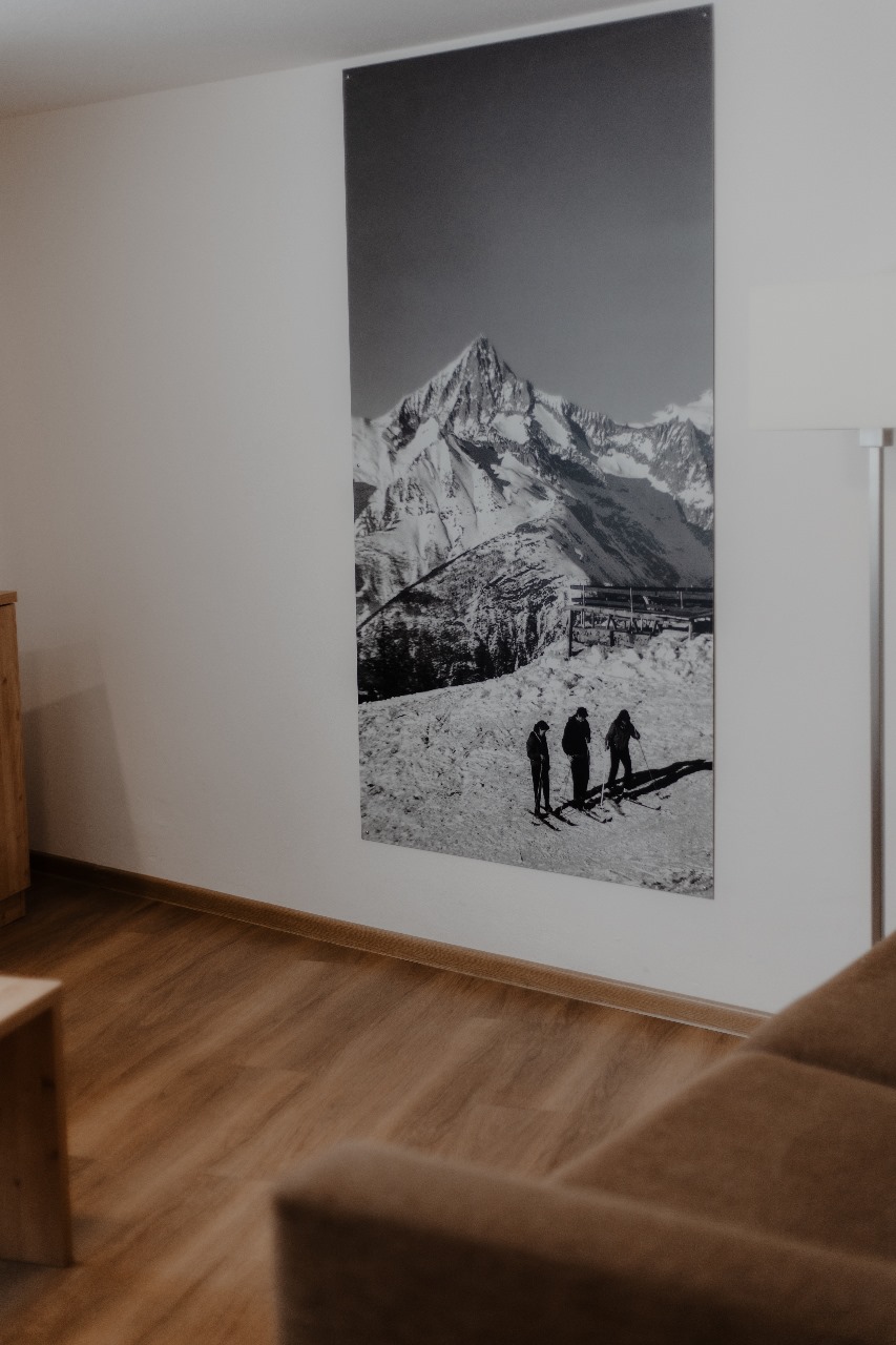 Elegant and spacious hotel room at Hotel Grächerhof, perfect for a Swiss Alps getaway