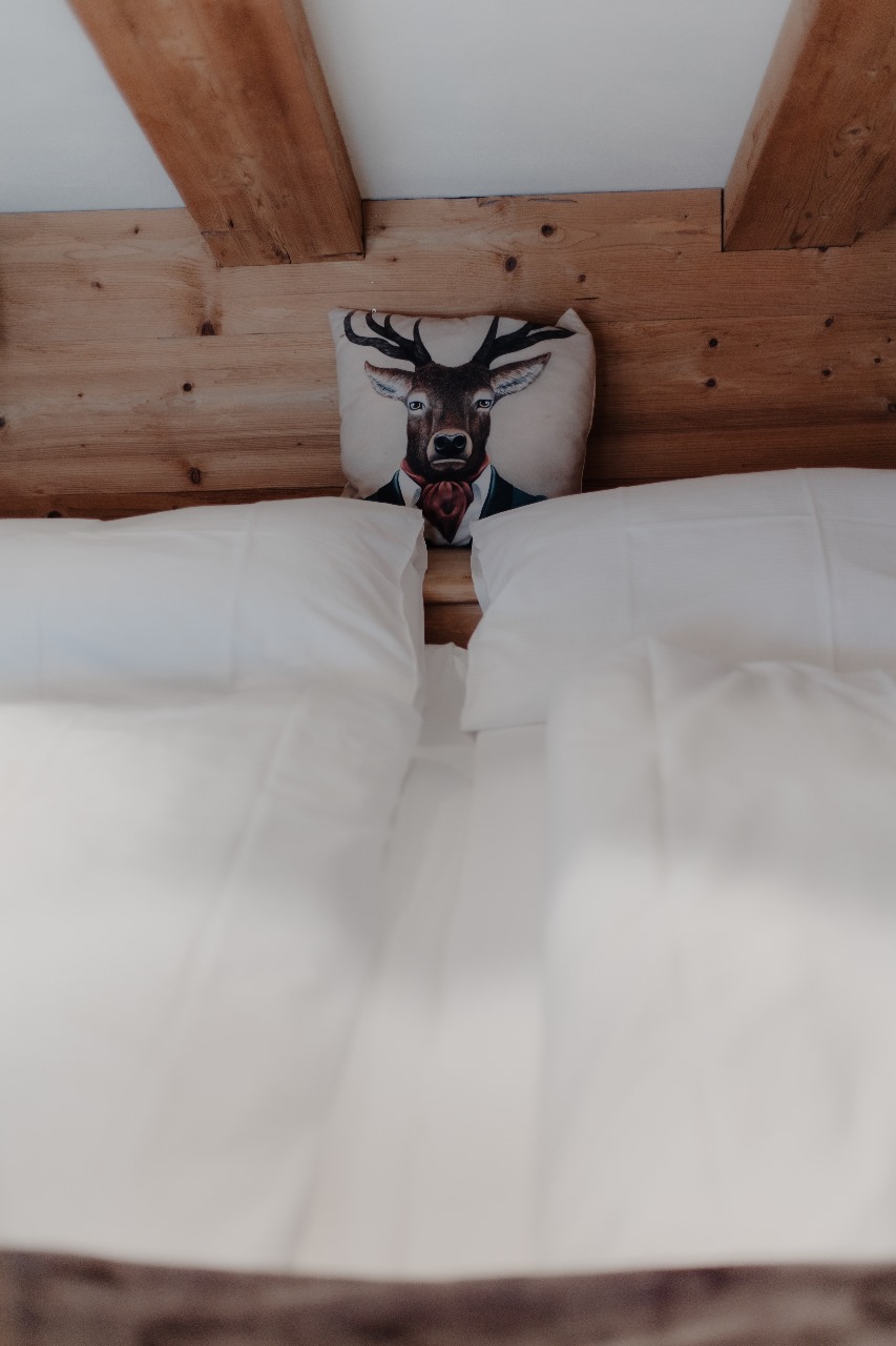 Elegant and spacious hotel room at Hotel Grächerhof, perfect for a Swiss Alps getaway