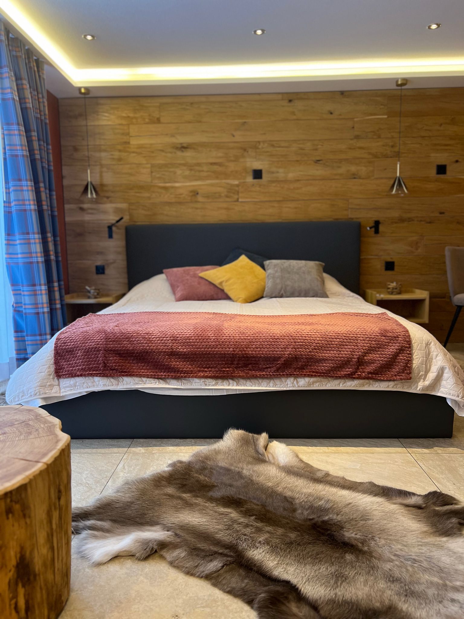 Elegant and spacious hotel room at Hotel Grächerhof, perfect for a Swiss Alps getaway