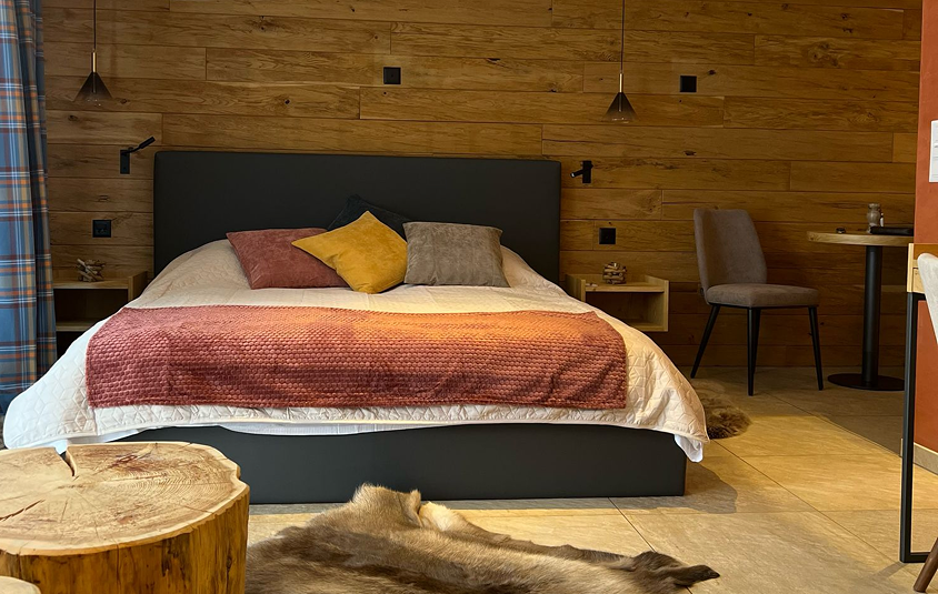 Elegant and spacious hotel room at Hotel Grächerhof, perfect for a Swiss Alps getaway