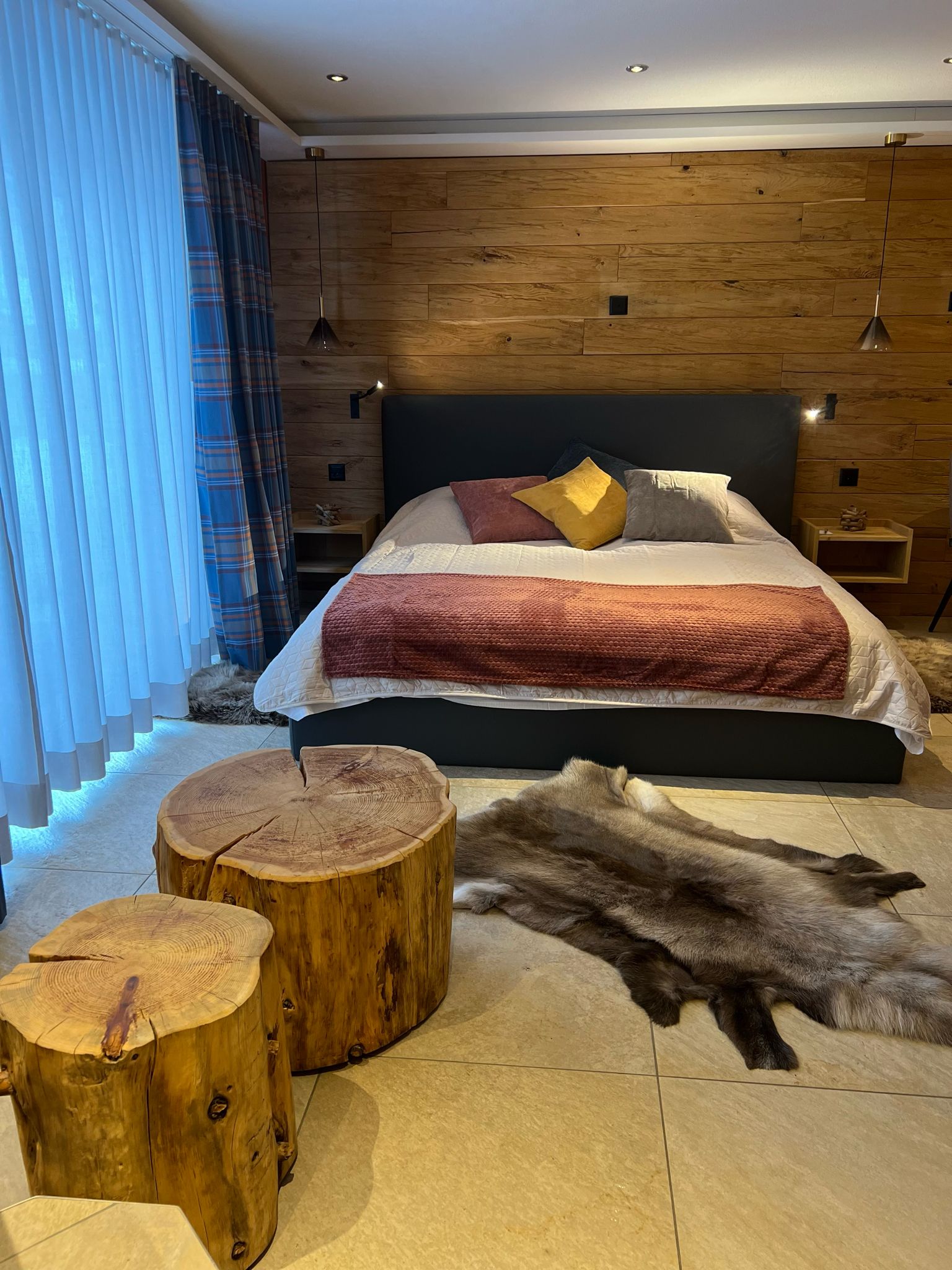 Elegant and spacious hotel room at Hotel Grächerhof, perfect for a Swiss Alps getaway